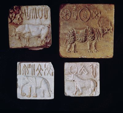 Four seals depicting a bull, a rhinoceros, an elephant and a tiger with pictographic symbols, from the Indus Valley, Pakistan, 3000-1500 BC by Harappan